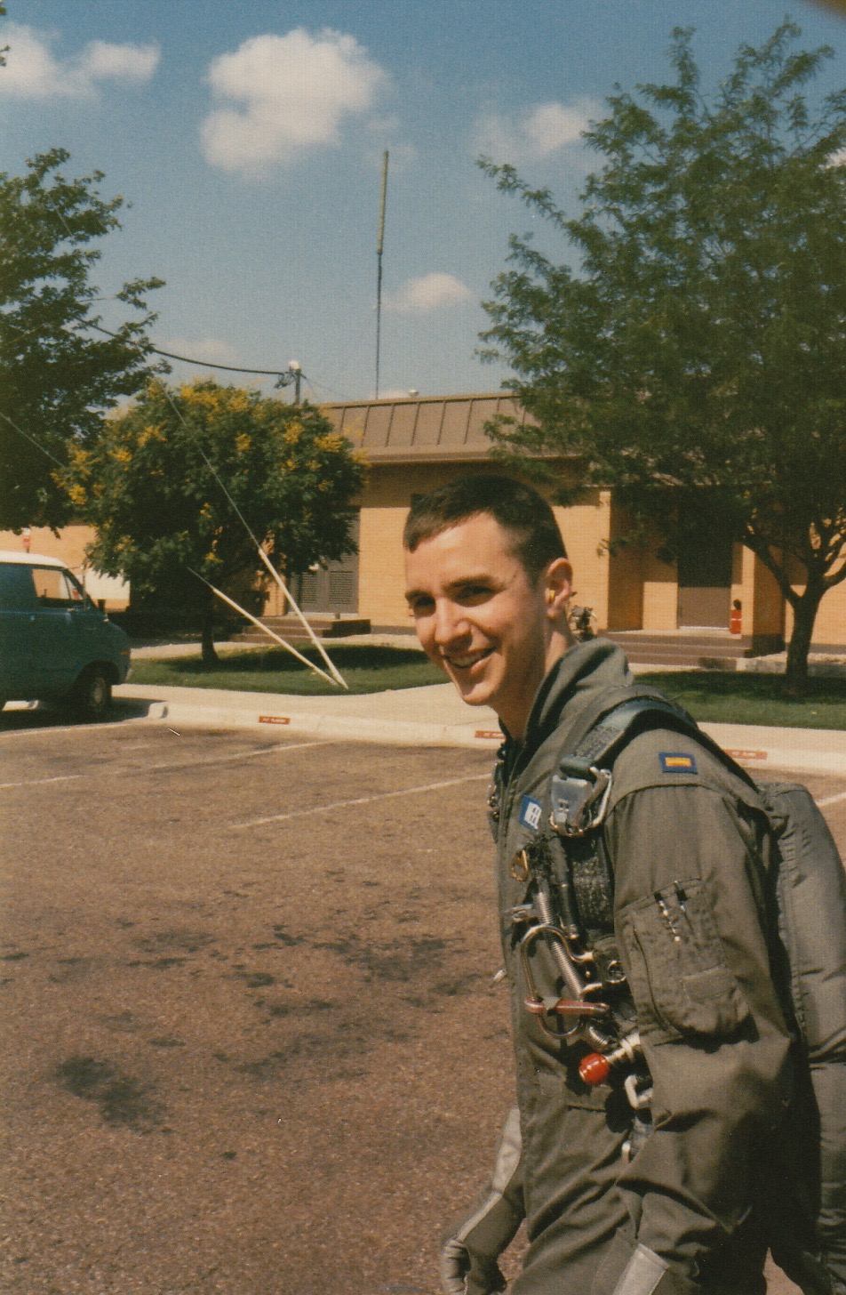 1989-07-04, USAF Pilot Training, Reese AFB, Texas. 2nd Lieutenant Erik J. Heels shortly after soloing a T-37 jet, shortly before being dunked in the pool. (Photo by Charles Anthony "Chuck" Cheatham, AKA Ghost Cheatham.)