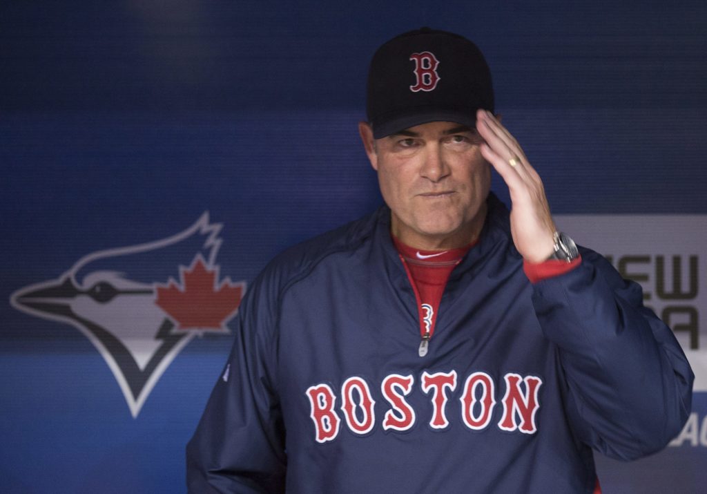 Boston Red Sox manager John Farrell gestures from the dugout before playing against the Toronto Blue Jays in a baseball game in Toronto, Friday, April 5, 2013. (AP Photo/The Canadian Press, Nathan Denette)